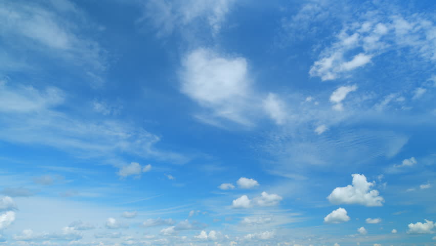 Light high clouds slide on sky. Layer of clouds in blue sky moving horizontal in opposite direction. Timelapse. Royalty-Free Stock Footage #1104627235