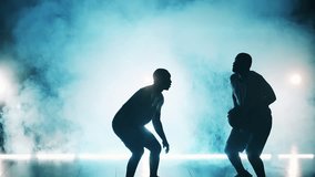 Slow motion of athletes practicing basketball in a room with smoke - Powered by Shutterstock - Get 15% off with code: PIKWIZARD15