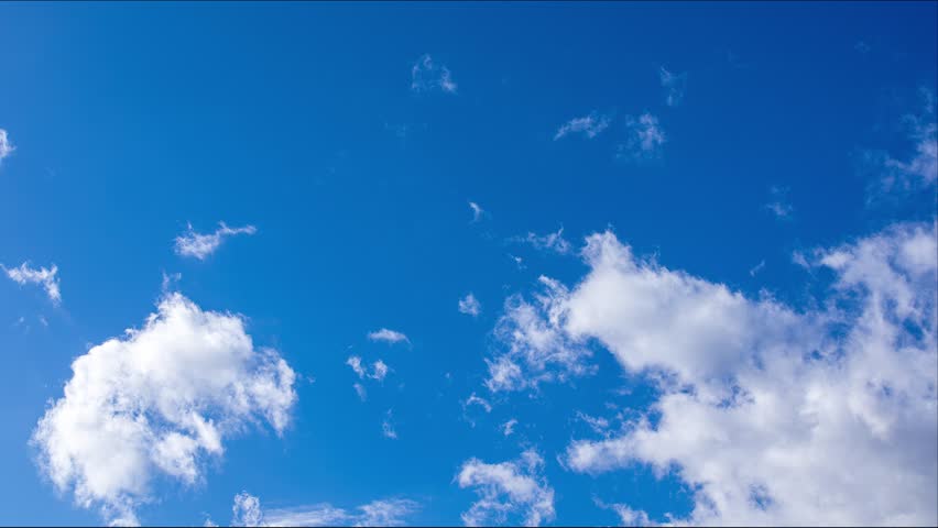 Timelapse of white clouds flowing vigorously in the blue sky Royalty-Free Stock Footage #1104633543