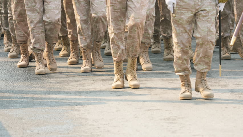 Military boots close up. Lot armed soldier walk slow motion. Male war team. Army platoon step. Many officers march. Men combat troop. Hot spot fight. Nation military forces. Sand desert shoe uniform.