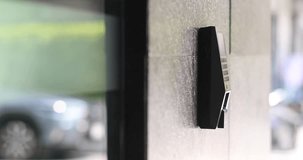 Use an electronic key card for access. Door access control. 
Man holding a key card to open the glass slide door at home or condominium. - Powered by Shutterstock - Get 15% off with code: PIKWIZARD15