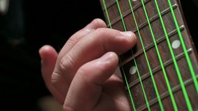 Man playing electric guitar. Music education. 4k video footage UHD 3840x2160