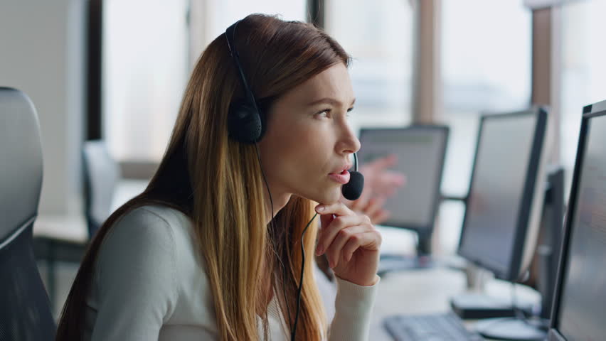 Customer service agent helping with solution on call. Inspired woman look idea talking client in headset. Friendly smiling representative resolving problem working computer. Helpline workflow concept Royalty-Free Stock Footage #1104643641