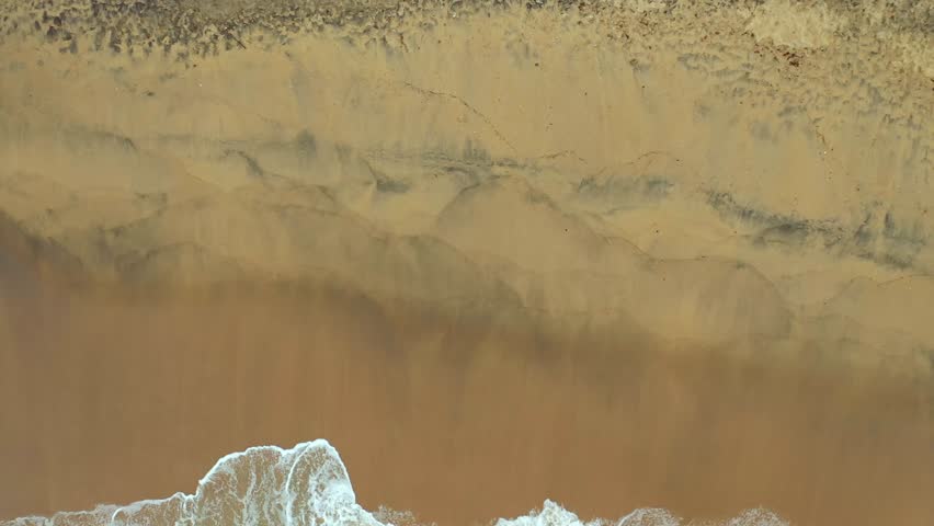 Aerial View of Sea Waves Reaching the White Sand Golden Shore of Galgibaga Beach India, South Goa