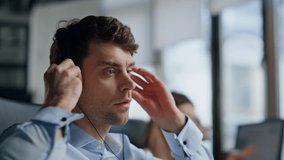 Agent hand taking headset from monitor closeup. Friendly hotline manager talking consulting client on call. Professional technical assistant man working call center look computer. Customer support job - Powered by Shutterstock - Get 15% off with code: PIKWIZARD15