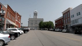 Maury County Courthouse and downtown buildings in Columbia, Tennessee with gimbal video walking forward.