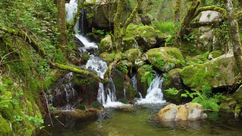 Waterfall at the arrival of tributaries to the Sil river canyon at the height of Peares, Ourense, Galicia, Spain