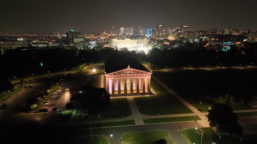 The Parthenon building at night in Nashville, Tennessee with drone video moving in a circle.