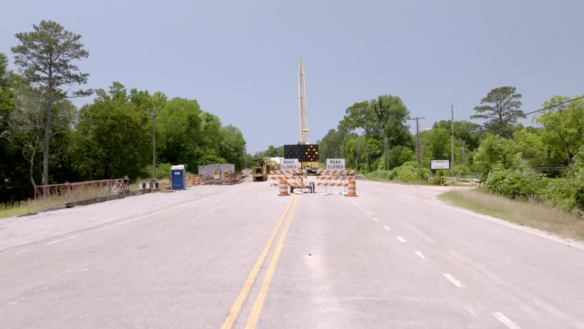 New bridge construction on Alabama Highway 5 in Pine Hill, Alabama with drone video moving forward low.