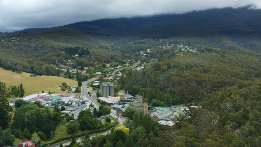 Aerial Drone Flyover Hobart Cascade Brewery Building And Surroundings On Cloudy Day, Tasmania 4K Slow Motion