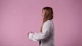 4k video of one girl who laughs at someone over pink background.