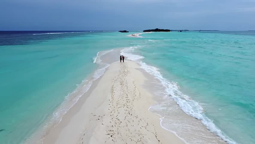 Couple Running on Tropical Maldives Sandbar on Romantic Honeymoon, Aerial