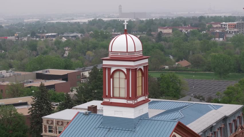 Church steeple in Colorado, USA. Aerial orbit with long zoom lens. Religion theme.