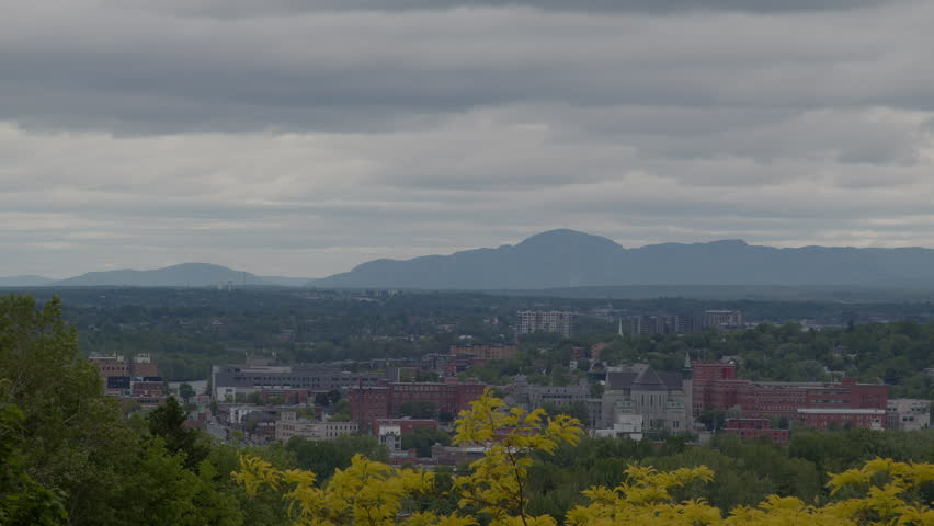 Sherbrooke city landscape with mountains Quebec Canada Estrie downtown trees and buildings time lapse slider