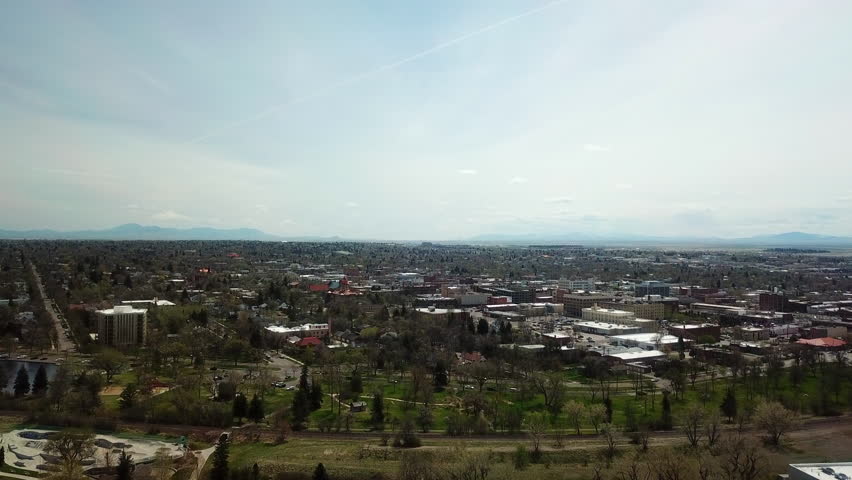 Aerial Forward Shot Of Residential Buildings In City Against Sky On Sunny Day - Billings, Montana