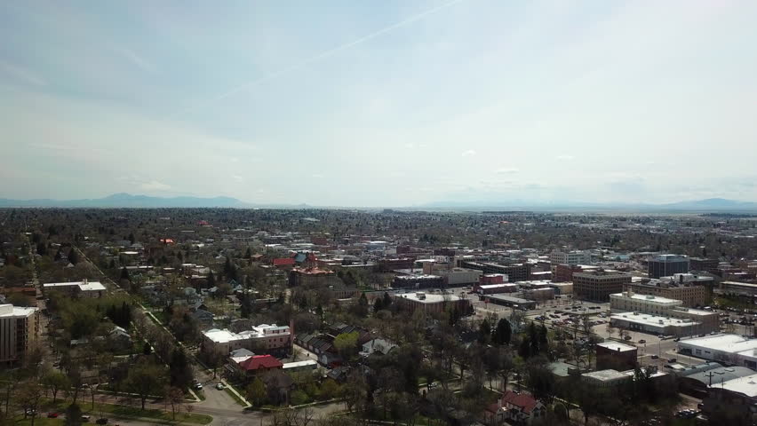Aerial Backward Shot Of Residential Buildings In City Against Sky On Sunny Day - Billings, Montana