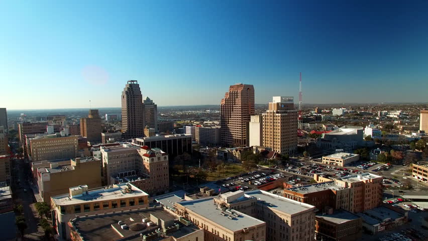 Aerial Forward Shot Of Buildings And Vehicles In City Against Blue Sky On Sunny Day - San Antonio, Texas