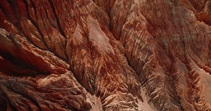 Immerse in the allure of Upper Mustang, Nepal, as a drone explores the unique, scary, and artistically structured orange-red dry mountains. Annapurna Area reveals its captivating beauty.