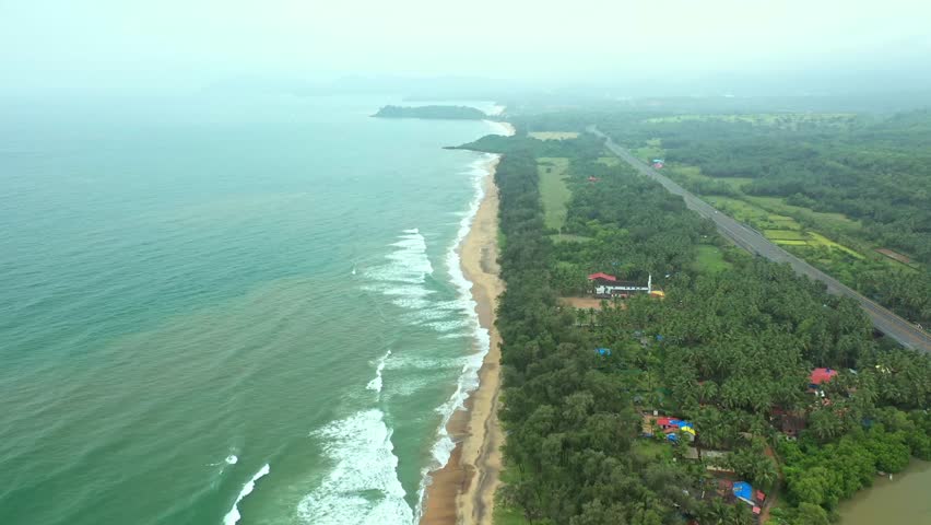 Aerial Panoramic View Above Beach Shoreline of Galgibaga South Goa, Forest and River and Skyline during Daylight