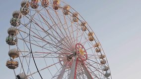 Ferris Wheel Swing in Amusement Park - Daytime Fun and Entertainment at Carnival or Theme Park. Perfect for Travel, Tourism, and Family Holiday Footage - Powered by Shutterstock - Get 15% off with code: PIKWIZARD15
