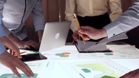 Close-up of office desk with many papers, graphs, analytical document. Coworkers, employees during conference, discussion of projects. Concept of business, office, teamwork, brainstorming, meeting - Powered by Shutterstock - Get 15% off with code: PIKWIZARD15