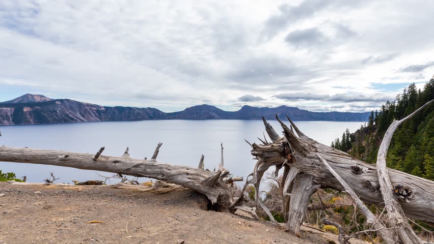 Time lapse of puffy clouds moving across the sky above Crater Lake in Oregon