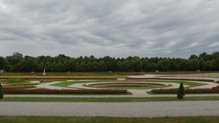 time lapse of dark clouds moving above an old classic  park and gardens