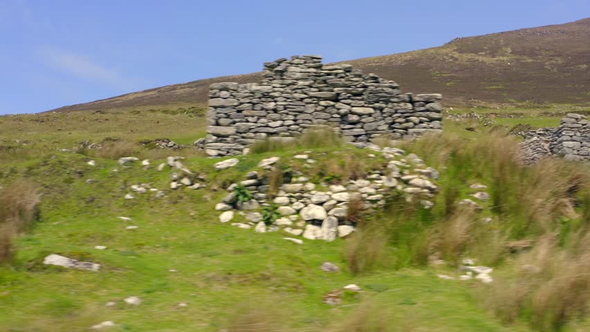 Eye level pan across old home stacked ruin walls by grassy hillside, achill island ireland
(deserted village at slievemore) Royalty-Free Stock Footage #1104695557