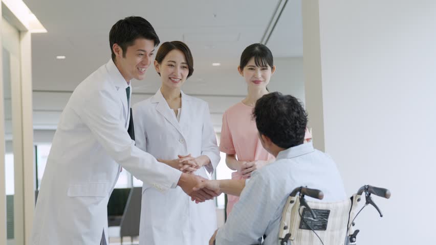 Doctor and patient shaking hands Royalty-Free Stock Footage #1104695863