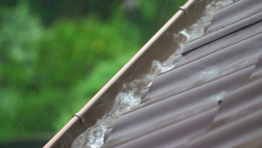 Heavy Rain Hitting House Roof and Rain Gutter During Thunderstorm Royalty-Free Stock Footage #1104703335