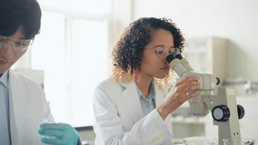 Multinational researcher group experimenting in the lab. - Powered by Shutterstock - Get 15% off with code: PIKWIZARD15
