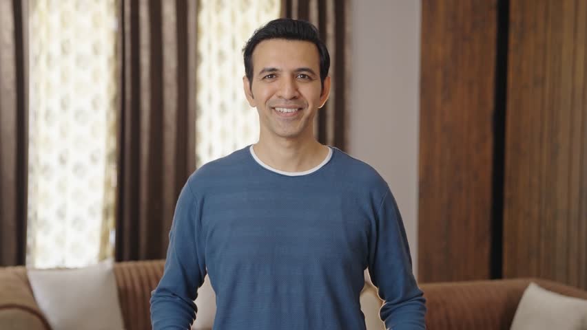 Happy Indian man holding TRUST banner