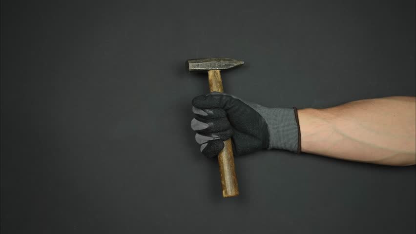Group of base tools for apartment renovation. Worker's hand holds instrument for house repair. Stop motion Royalty-Free Stock Footage #1104739559