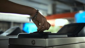 Passenger passes through the subway turnstile by attaching a plastic ticket card, high quality 4K public transportation concept footage. Bangkok, Thailand. - Powered by Shutterstock - Get 15% off with code: PIKWIZARD15