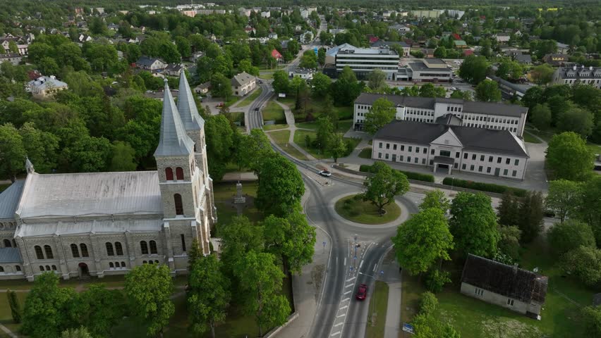 Aerial approaching view of Rapla Maarja-Magdaleena Church which is the only rural church with two towers in Estonia.