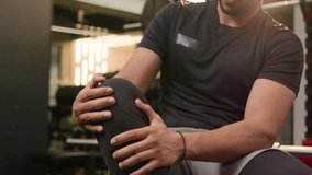 Sad suffering African American sportsman athlete runner sporty man feel knee ache muscle pain male bodybuilder suffer health problem painful leg trauma injury after fitness sport gym workout cramp - Powered by Shutterstock - Get 15% off with code: PIKWIZARD15