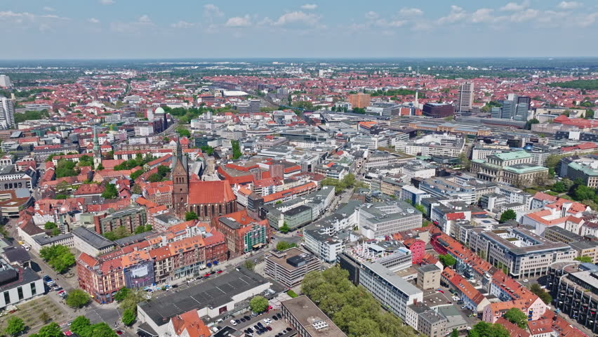 Drone shot of Hanover city centre , Germany . The historic heart of the city, Mitte is full of restaurants, cafes, and department stores. Monuments dot the largely pedestrianized Altstadt area .