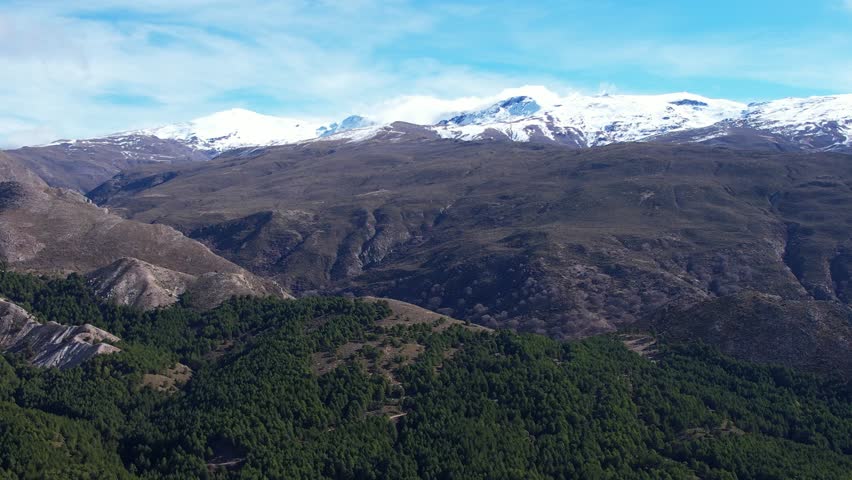 Sierra Nevada mountains in Andalusia Spain as seen from aerial fly over 
