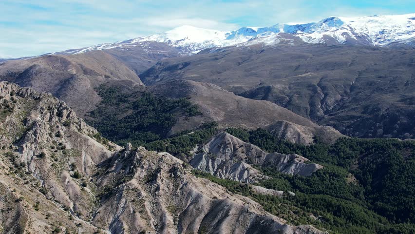 Sierra Nevada mountains in Andalusia Spain as seen from aerial fly over 