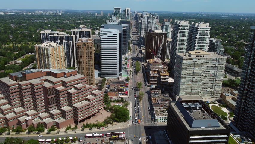 Aerial shot of the urban neighborhood revealing city skyline