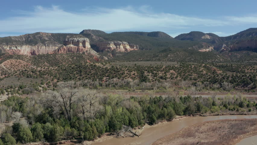 Aerial landscape view of New Mexico desert with mountains and river