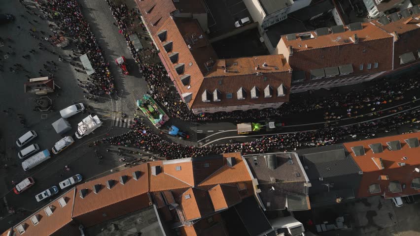 Top-down shot of crowded streets watching the Brunswick Carnival pass