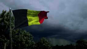 waving Belgium flag for veterans day on dark storm cumulus clouds - Powered by Shutterstock - Get 15% off with code: PIKWIZARD15