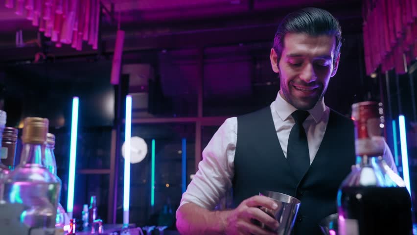 Bartender man shaking tasteful cocktail prepare for guest in club lounge or night party Royalty-Free Stock Footage #1104762829
