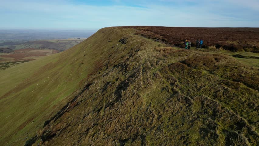 4K Drone video of hikers on Hay Bluff, Lord Herefords Knob, Brecon Beacons National Park, Wales. Near Hay on Wye, Powys in February. Forward motion.