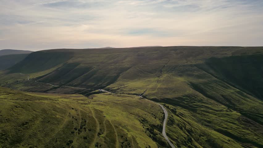 4K Drone video of hikers at Hay Bluff, Lord Herefords Knob, Brecon Beacons National Park, Wales. Near Hay on Wye, Powys in February. Ascending motion.