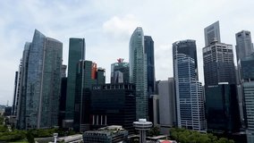 Aerial 4K footage of Singapore landscape with modern office buildings and skyscrapers in marina bay