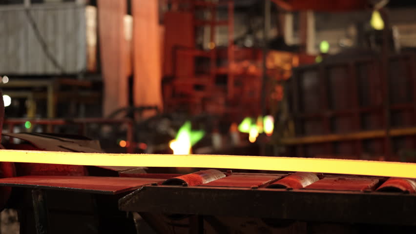 Molten copper, Industrial production, Copper wire. Conveyor system shown transporting molten copper wire on production line at manufacturing plant. Royalty-Free Stock Footage #1104768723