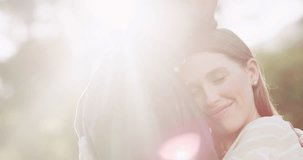Nature, love and couple hug with sunshine for bonding, romance and loving affection outdoors. Relationship, dating and happy man and woman hugging in park for quality time, intimacy and commitment - Powered by Shutterstock - Get 15% off with code: PIKWIZARD15