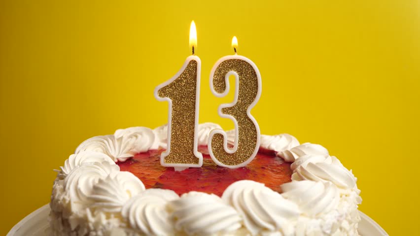 A candle in the form of the number 13, inserted into the holiday cake, is blown out. Celebrating a birthday or a landmark event. The climax of the celebration.